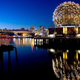 A photo of the Vancouver skyline at night.
